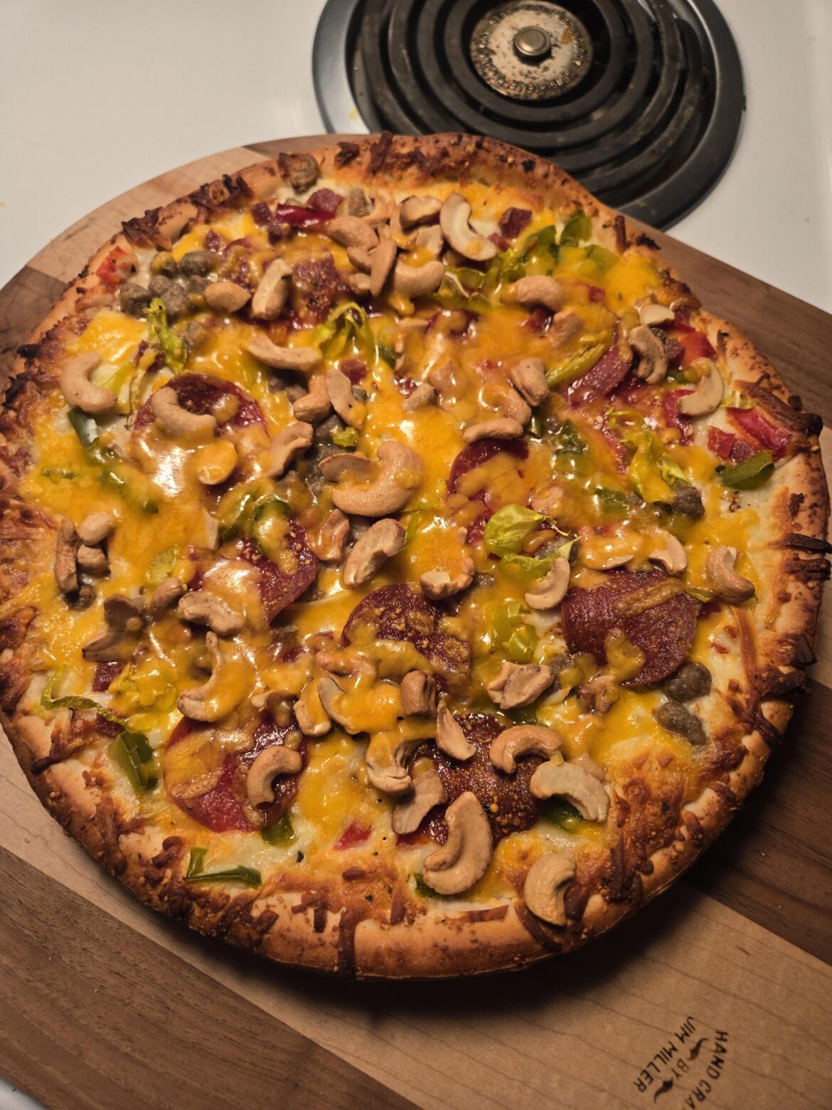 Sometimes you gotta add cashews, banana peppers, and cheddar to the supreme 'za