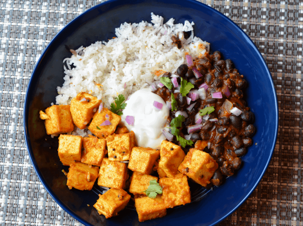 428 cal Tofu with Brooklyn Delhi tikka masala sauce, black beans with Brooklyn Delhi black bean butter masala (vegan), basmati rice, vegan yogurt
