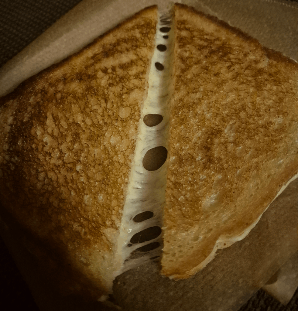 Soft sourdough, white cheddar with salted butter and olive oil for cooking
