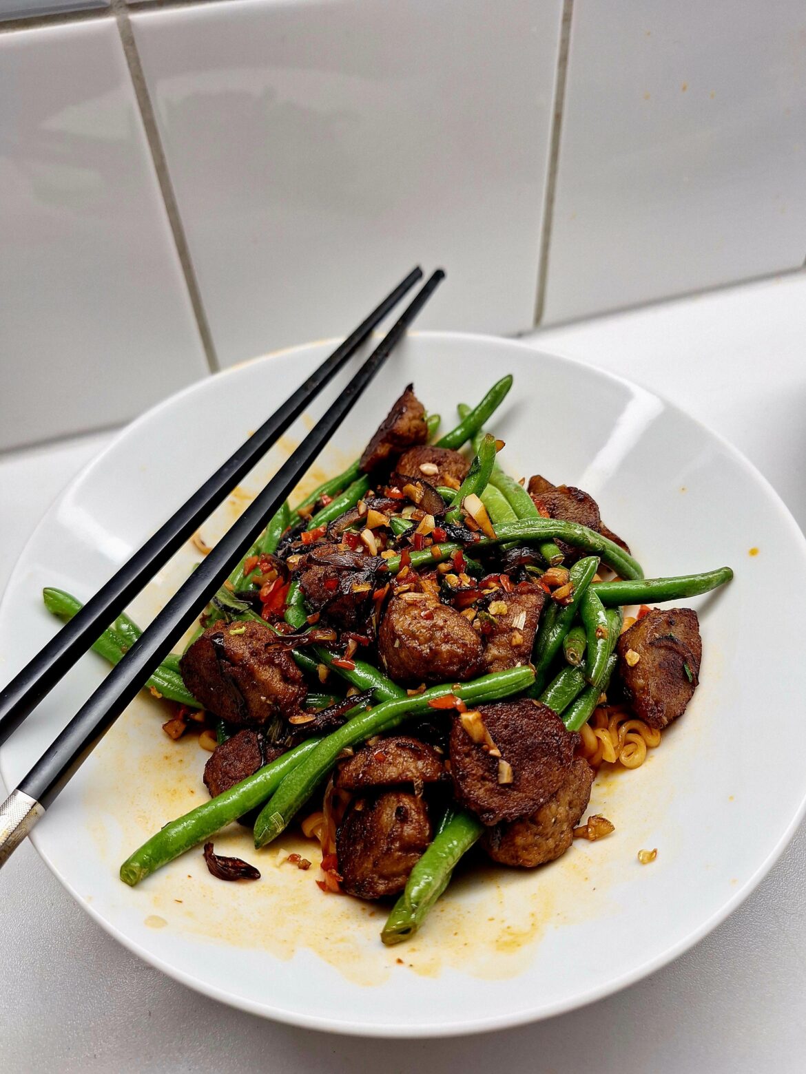 Ghost pepper and garlic fried meatballs and greenbeans on gochujang noodles