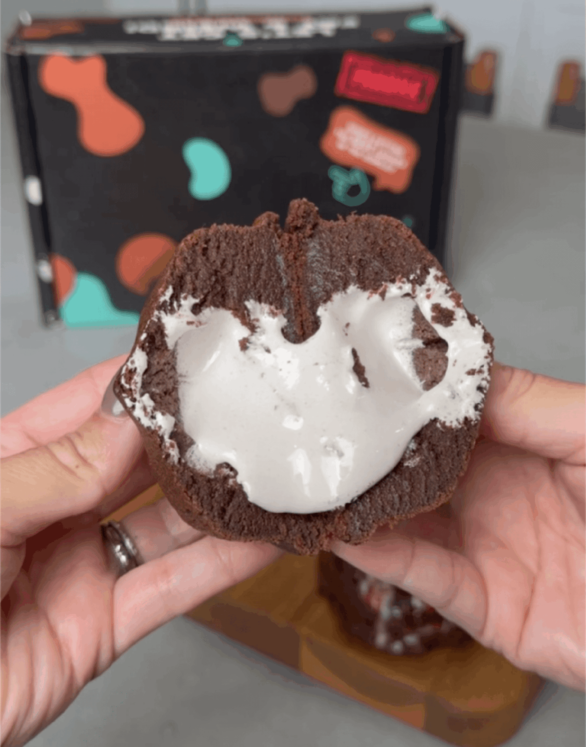 Yummy Hot Cocoa Cookie base stuffed with Chocolate Cake Chunks, Hand-Crafted Hot Cocoa Mix, and a Marshmallow Cream Core