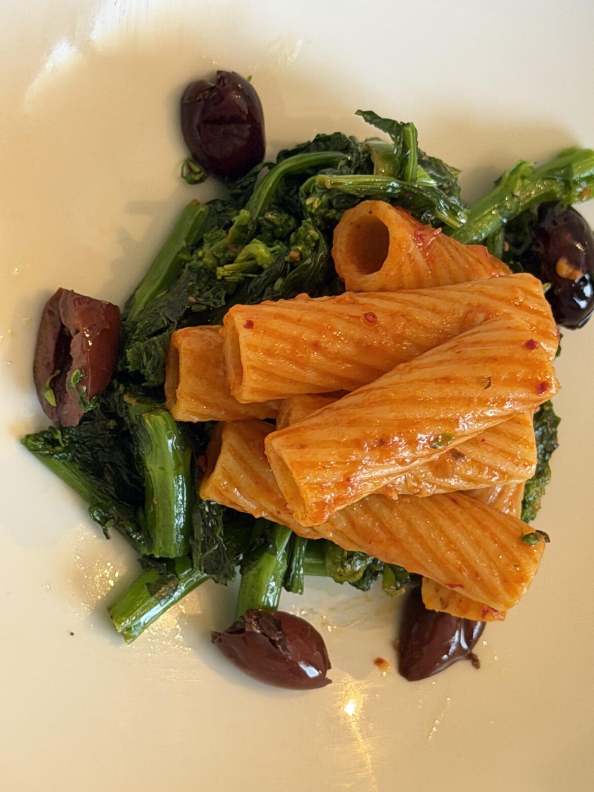 Rigatoni with nduja calabrese sausage on garlic rapini and olives.