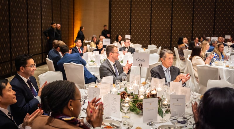 Attendees at a Christmas dinner hosted by The Church of Jesus Christ of Latter-day Saints listen to Elder Rubén V. Alliaud, president of the Europe Central Area, during his keynote address in Geneva, Switzerland in Dec. 2025.