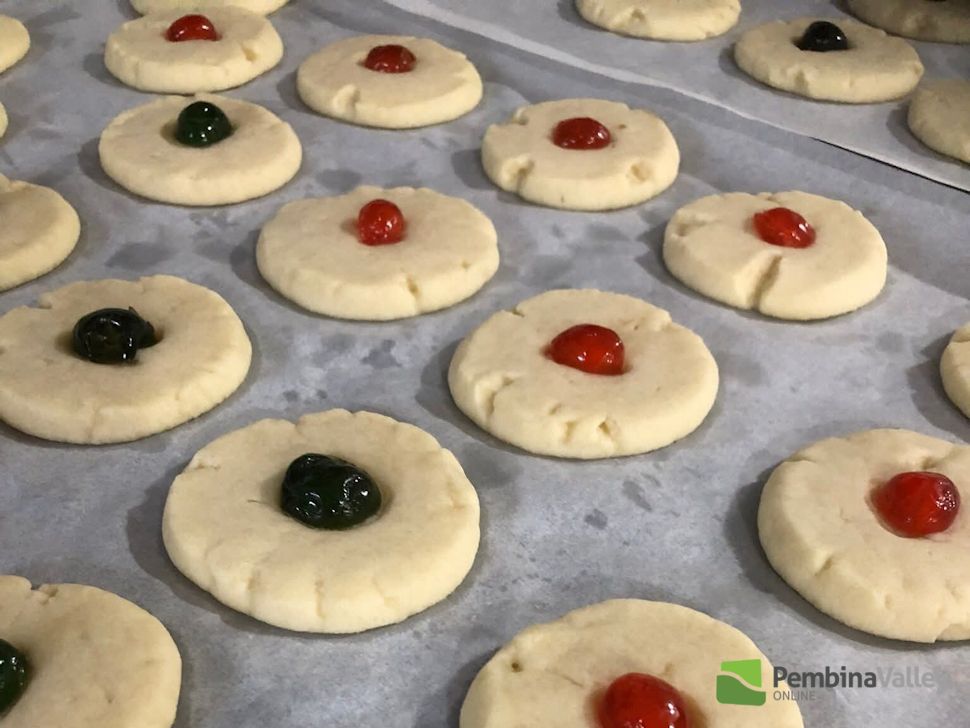 Hilda Gerbrandt (left), and younger sister Rose Froese (right), stop by the radio station with a tray of delicious homemade Christmas baking