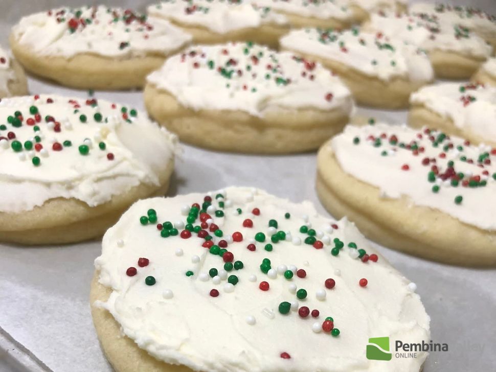 Hilda Gerbrandt (left), and younger sister Rose Froese (right), stop by the radio station with a tray of delicious homemade Christmas baking