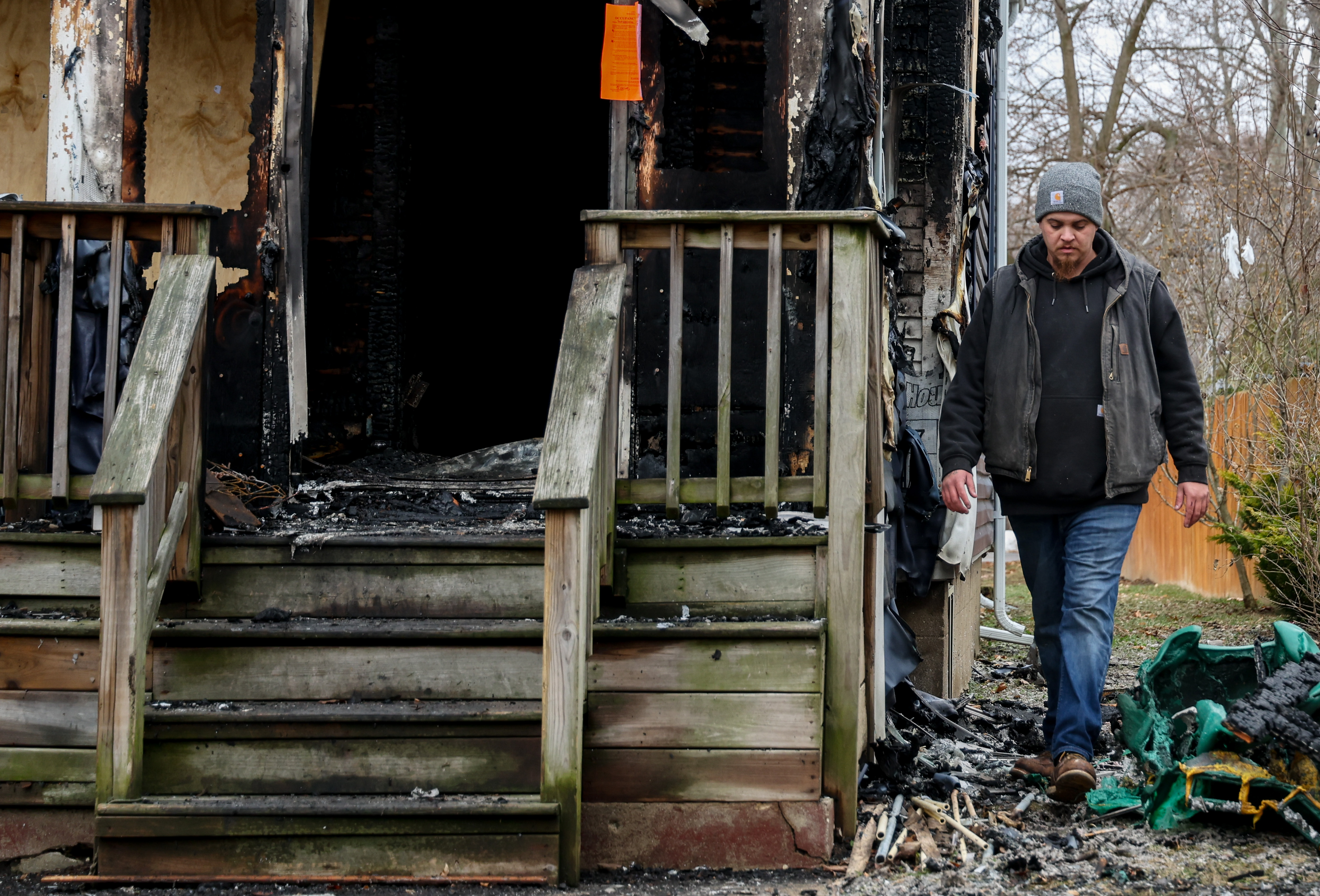 Joshua RodrÃ­guez, with 911 Fire Board-Up and Construction, walks around...