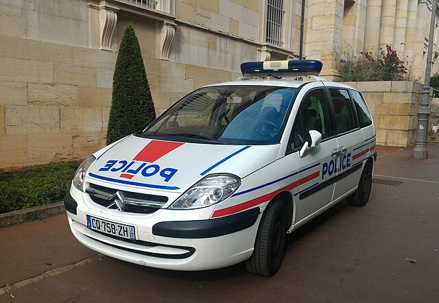 Nanny From Algeria on Trial for Allegedly Poisoning French Jewish Family’s Food and Drinks French police vehicle parked outside a building
