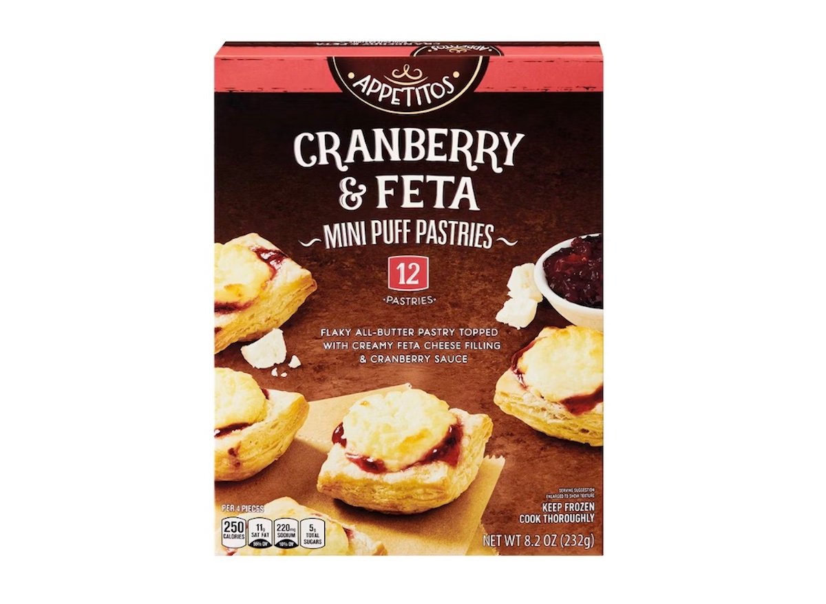 A box of Appetitos Cranberry & Feta Mini Puff Pastries, showing an image of golden pastries topped with feta cheese and cranberry sauce. The box contains 12 pastries and weighs 8.2 oz (232g).