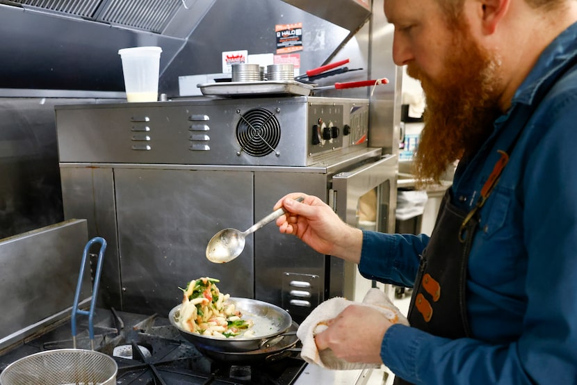 Chef Matt Ford tosses ricotta cavatelli with roasted tomato, Harris pesto and wilted greens...