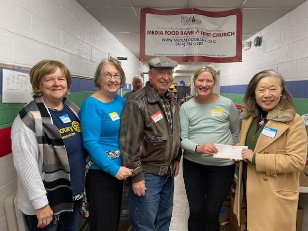 Media Rotary President Mina Yi-Merizalde, right, presents a $2,000 check to Media Food Bank Assistant Director Marilyn Bess, second from right. With them are Rotarians, from left, Janice Miller-Lion, Jeanne Stolar and Larry Smoose. (COURTESY OF MEDIA ROTARY CLUB)