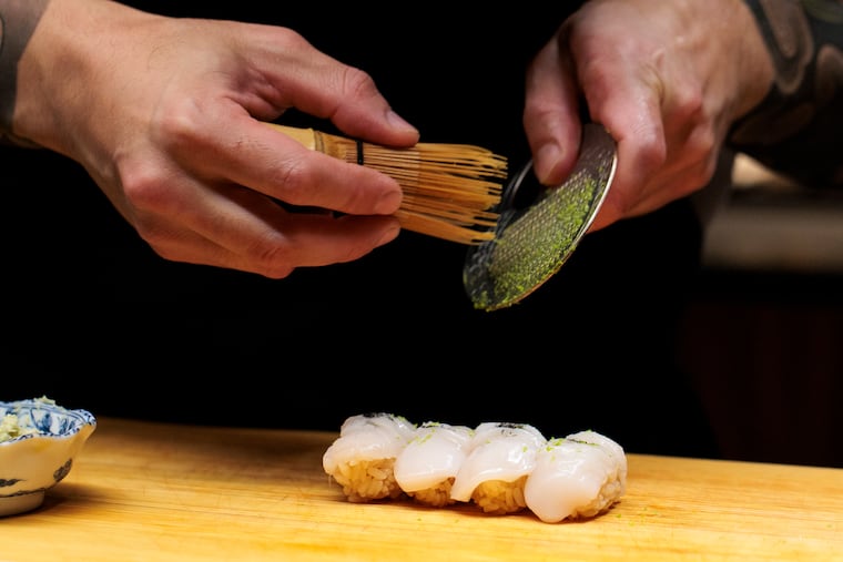 Chef Jesse Ito prepares the Hotate during the omakase at Royal Sushi and Izakaya on Tuesday, Oct. 28, 2025 in Philadelphia.