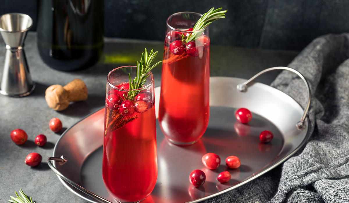 Boozy Holiday Cranberry Champagne Poinsettia Cocktail with Rosemary