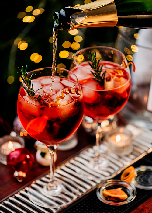 The Classic Spritz is made with fresh, unsweetened cranberry juice, orange juice, Prosecco, and Aperol. Mix the ingredients in a pitcher and pour into oversized wine glasses filled with ice. Decorate with a citrus twist, a fresh sprig of rosemary; it’s delicious and refreshing. Pic: Getty Images