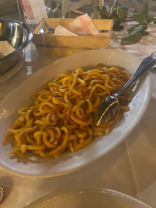 A plate of Strozzapretti pasta.
