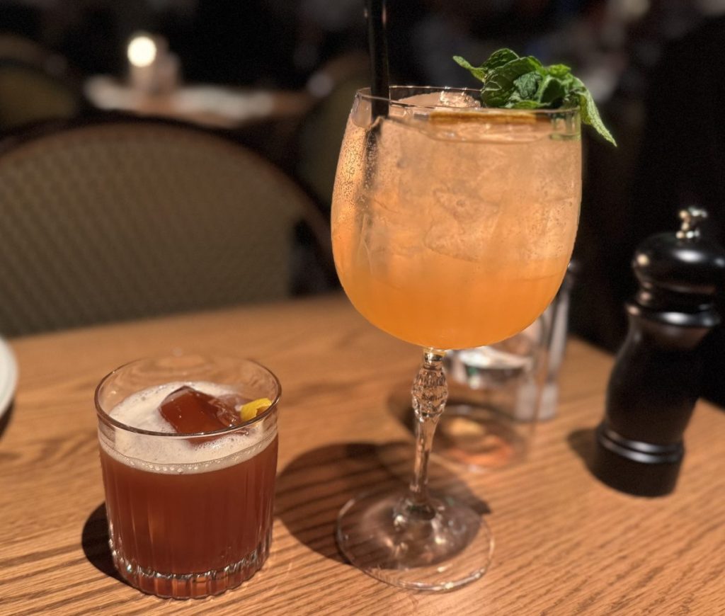 Two cocktails on a table.