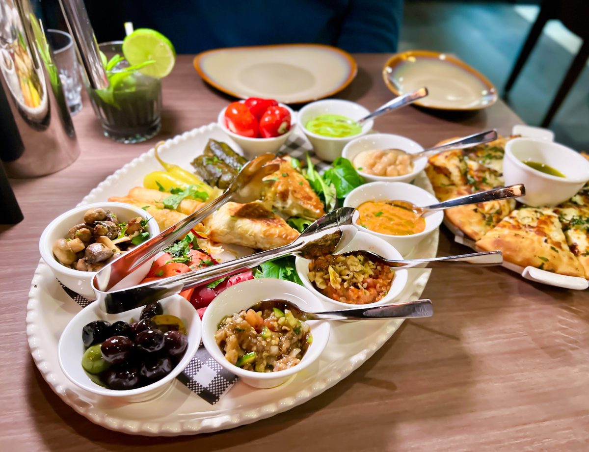 Platter of dips and snacks with bread