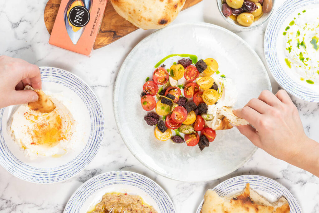 selection of greek food including tomato dish at kallos one of the new greater amcnester restaurants this march