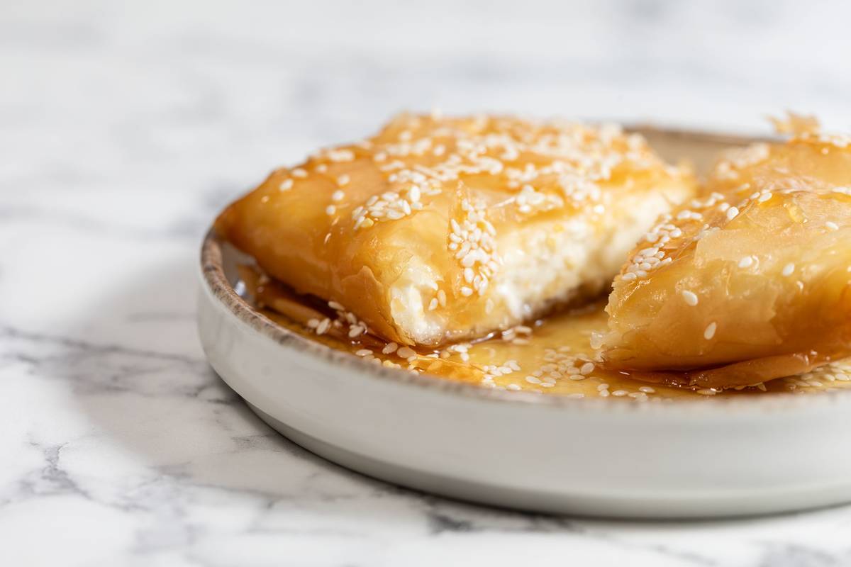 feta in filo pastry topped with sesame seeds and honey