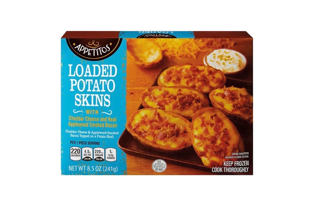 A box of Appetitos Loaded Potato Skins featuring an image of potato skins topped with cheese and bacon. The packaging highlights cheddar cheese, smoked bacon, and nutrition information.