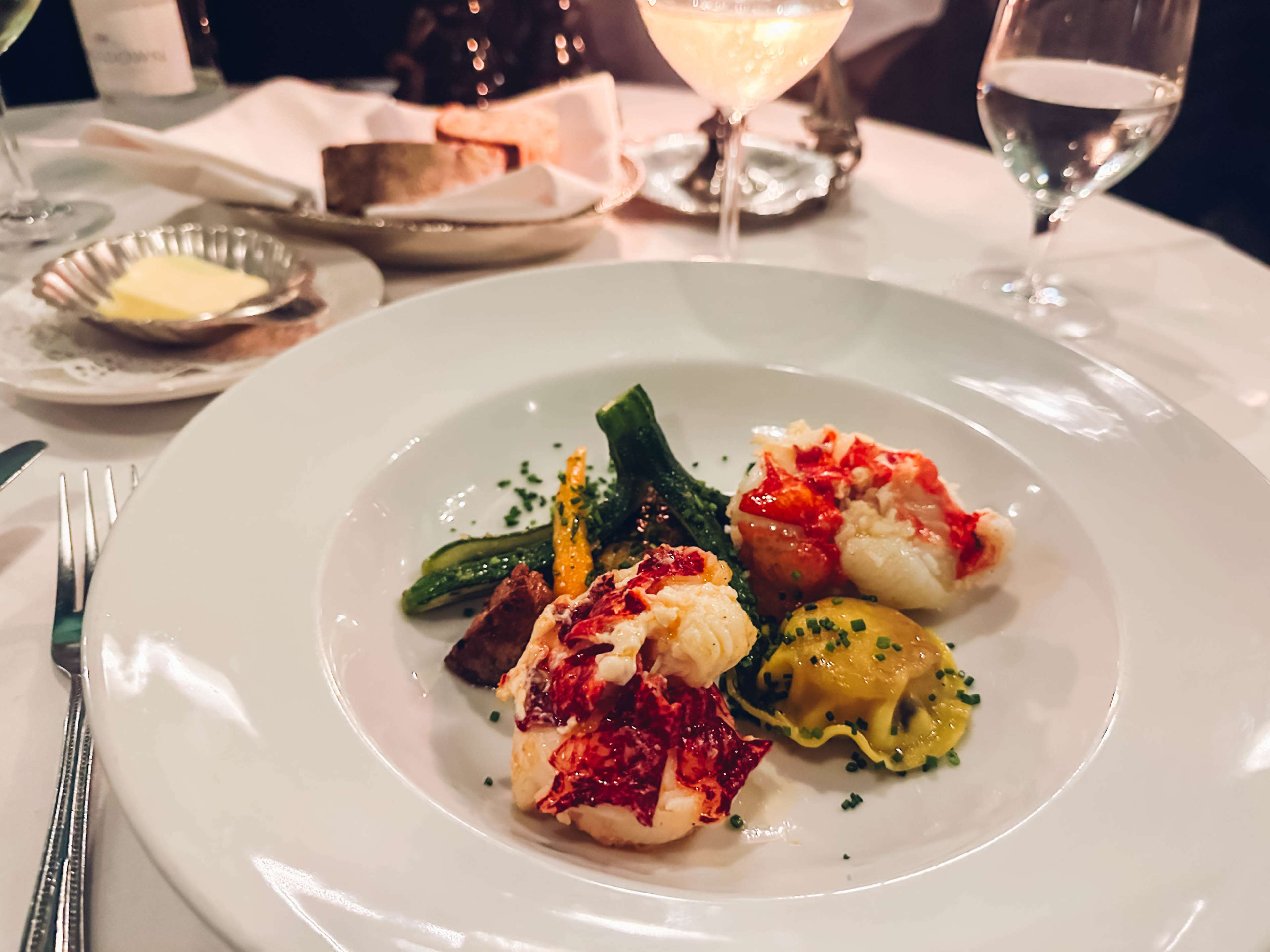 The Lobster Tail, Raviolo, Otto’s Pressed Lobster Sauce, Seared Veal Sweetbread And Foie Gras from Otto's French Restaurant.