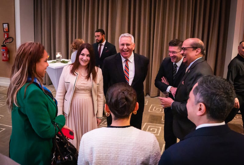Elder Rubén V. Alliaud, president of the Europe Central Area, and his wife, Sister Fabiana Alliaud greet guests in Geneva, Switzerland in Dec. 2025.