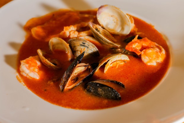 Bouillabaisse is the iconic fish stew of Marseilles, thought to have first been made by fishermen with the unsold leftovers from the day's catch, seasoned with wild herbs, cooked in kettles of sea water over wood fires. (Ray Chavez/Bay Area News Group)