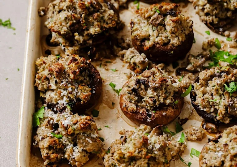 Stuffed mushrooms on a serving tray.