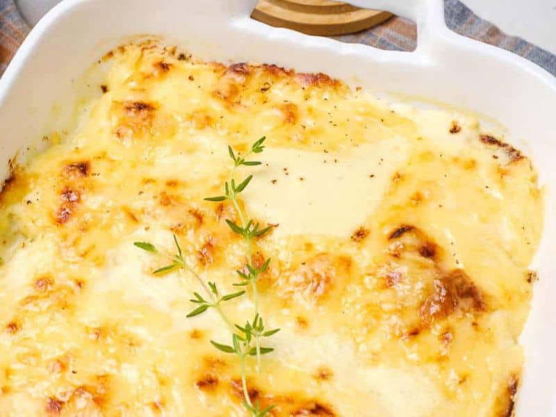 An oven dish with baked dauphinoise potatoes in it.