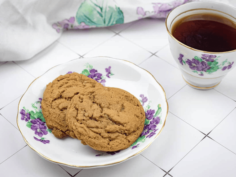A plate of Spiced Ginger Cookies and a cup of tea.