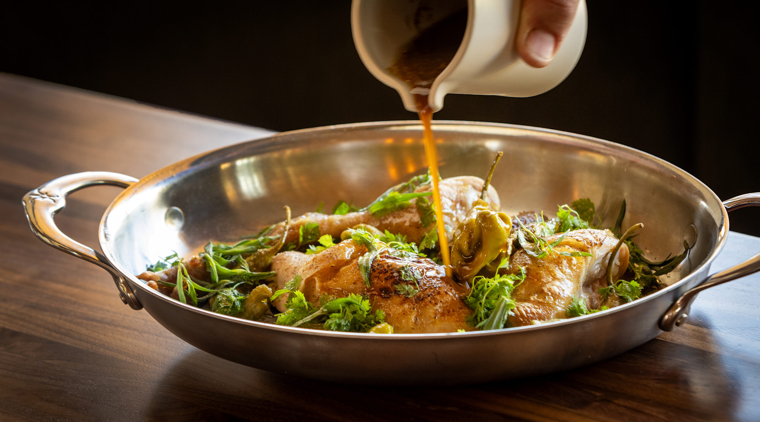Mary’s Whole Chicken with pickled shishito pepper and garden herbs from Folia Friday, September 19, 2025 in Healdsburg. (John Burgess / The Press Democrat)