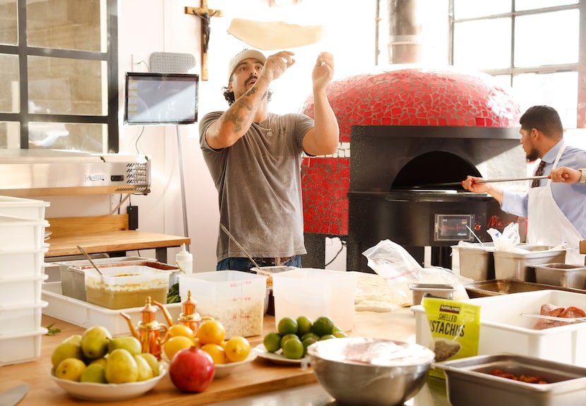 Felina owner Alessandro Salvatore tosses dough during a holiday pop-up.