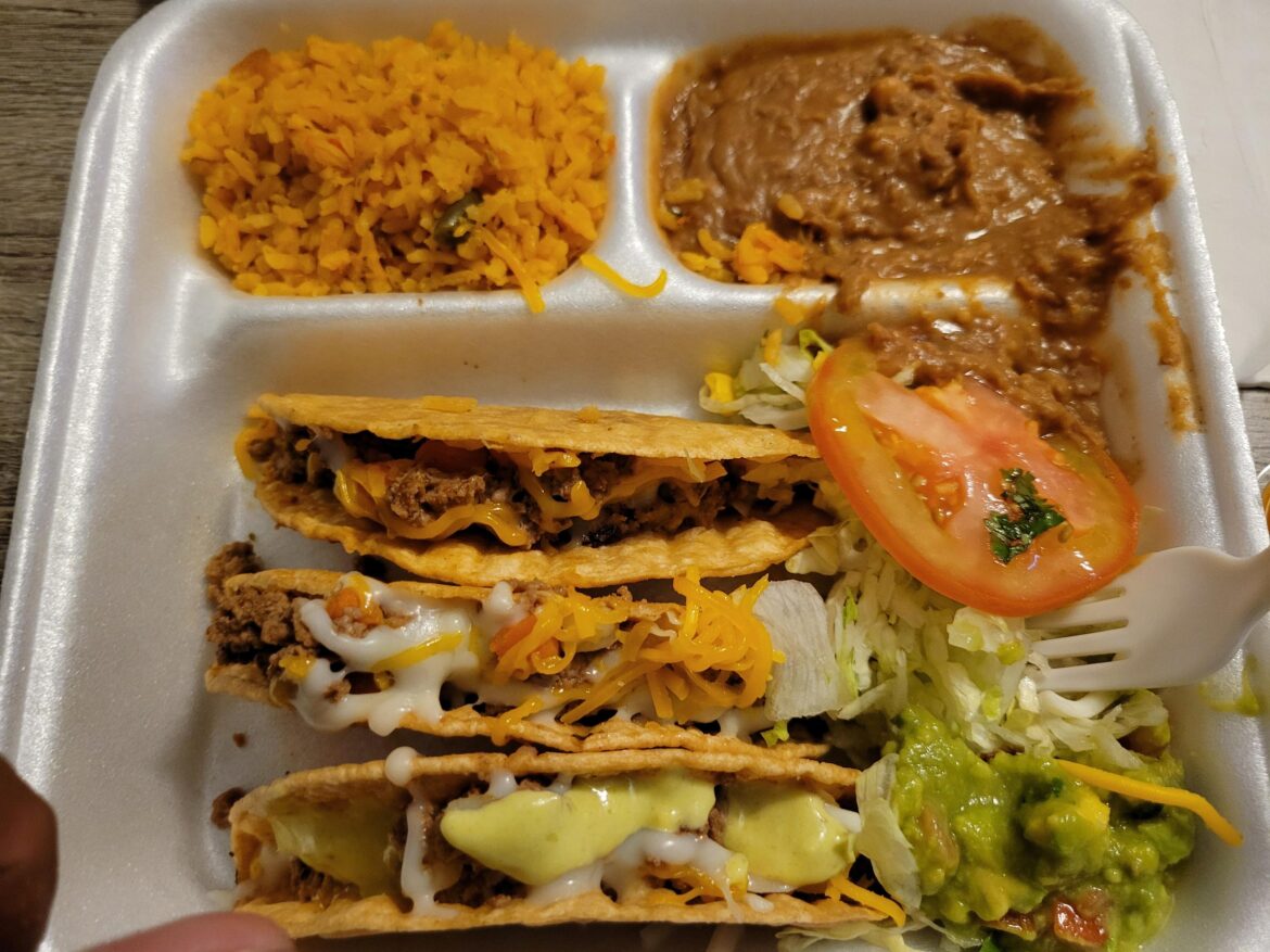 This $8 piccadillo plate beats Taco Bell across the street.