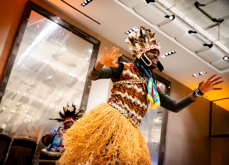 A performer dances as part of a cultural celebration at a Christmas dinner hosted by the Church of Jesus Christ of Latter-day Saints in Geneva, Switzerland, in Dec. 2025.
