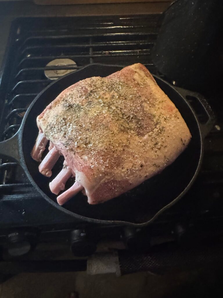 Camper cookin pork rack with a little (ok a lot of) bourbon
