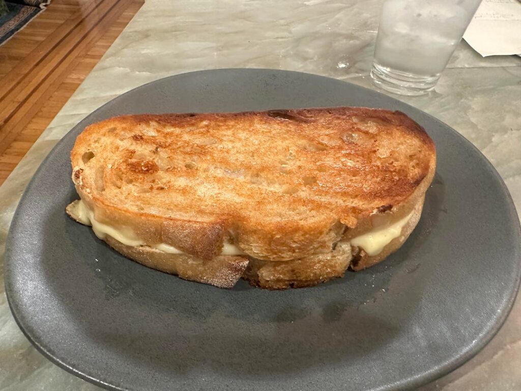 Make the bread. Then make the grilled cheese. Deli thick cut white American cheese on home-baked sourdough rye