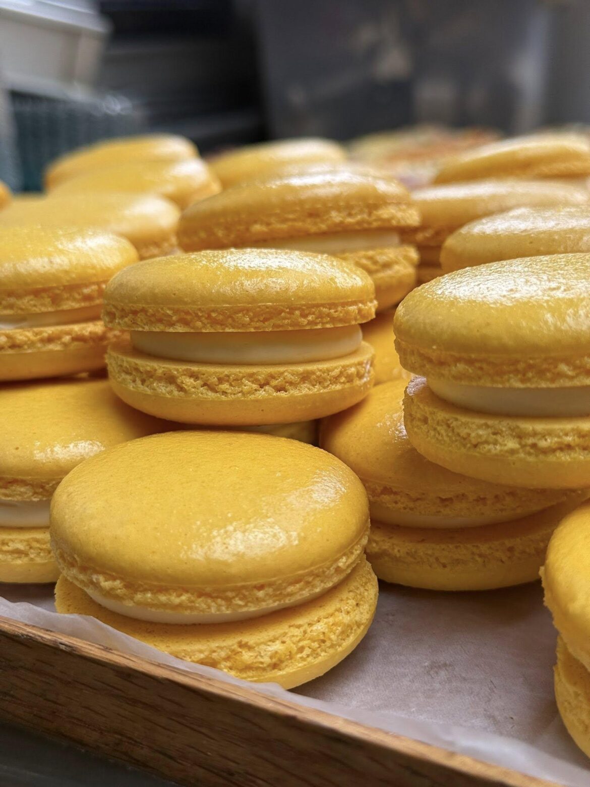 Freshly baked lemon macarons filled with silky vanilla-bean buttercream [OC]