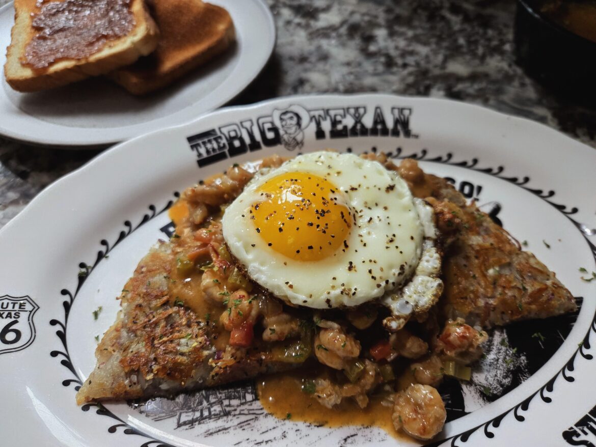 Put a farm egg on Hashbrowns covered in crawfish étouffée