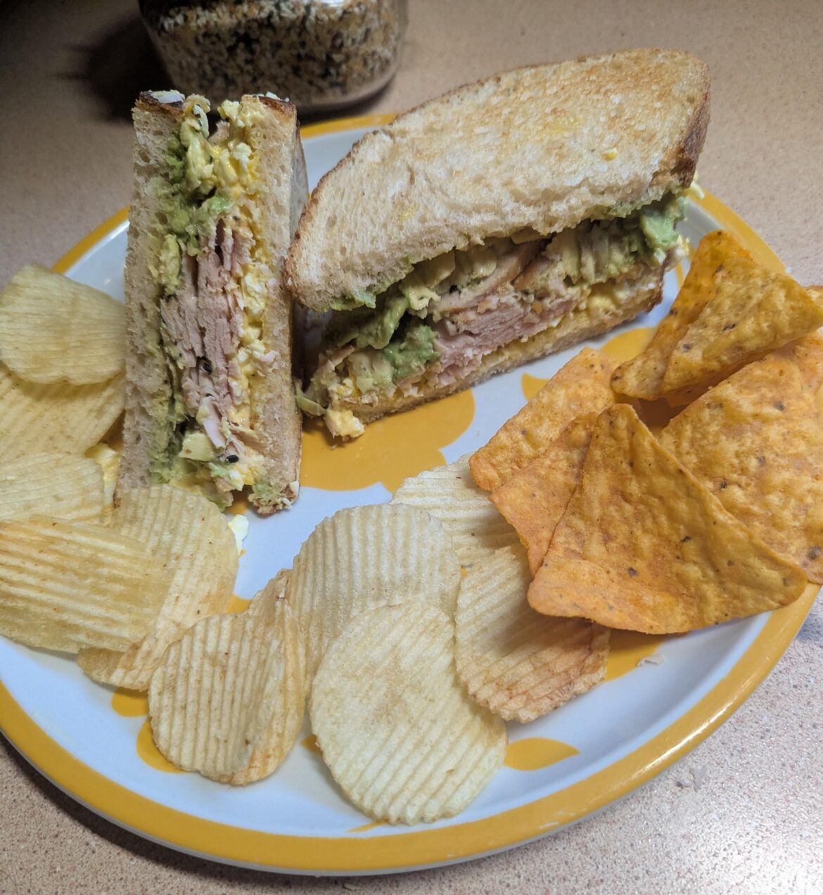 Deviled egg salad,roast turkey, and avocado on extra sour sourdough toast