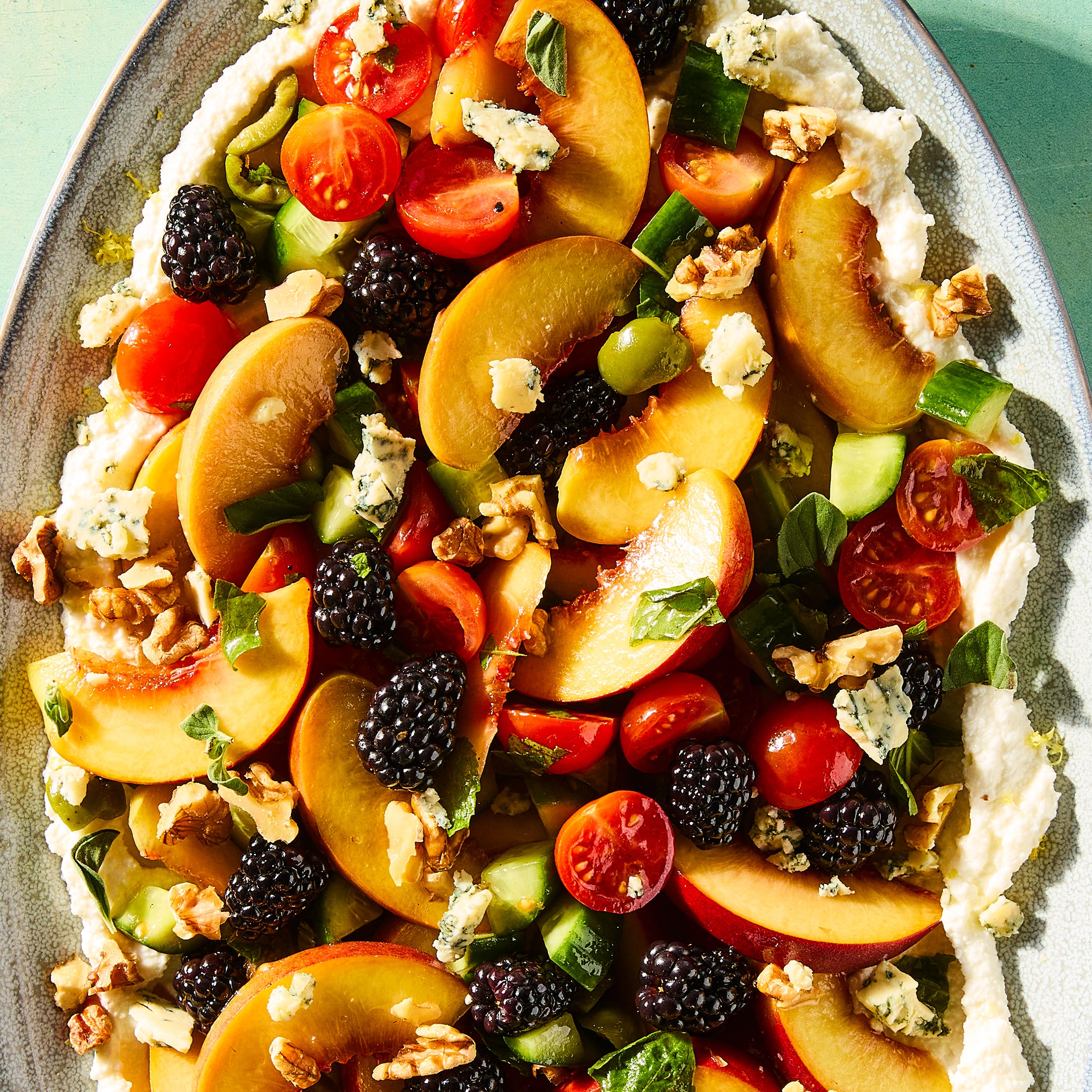 blackberries, peaches, tomatoes, blue cheese, walnuts, basil, and olives