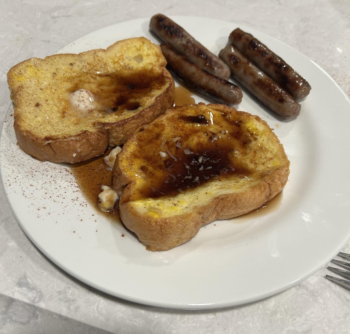 Cinnamon French Toast with syrup and side of breakfast sausage (don’t throw away old bread)