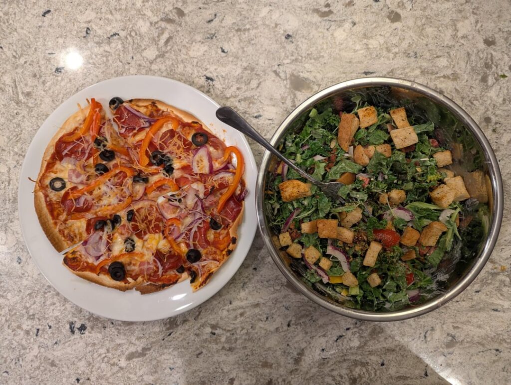 Huge salad and pizza, 823 calories for both, 88g protein and 45g fiber