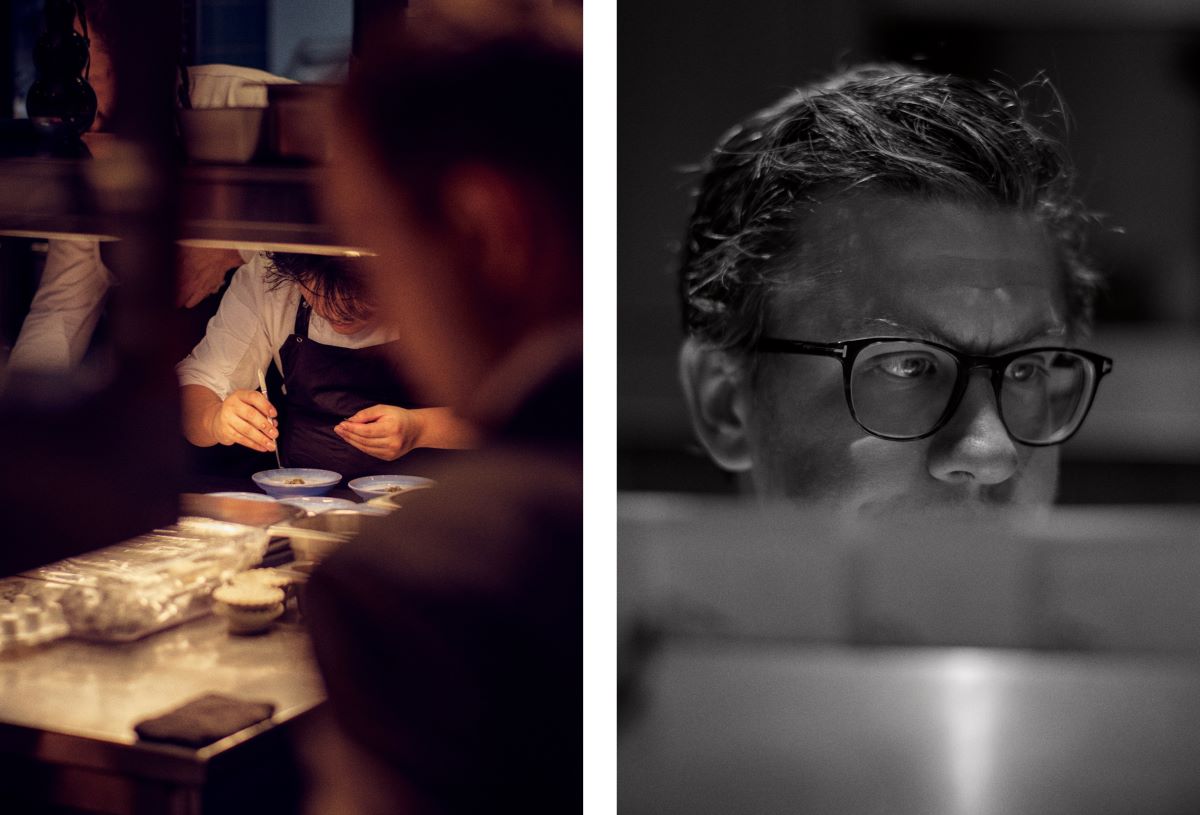 Plates being carefully arranged in the kitchen and Dominik Schmid fully focused at work. © Wim Jansen/The MICHELIN Guide