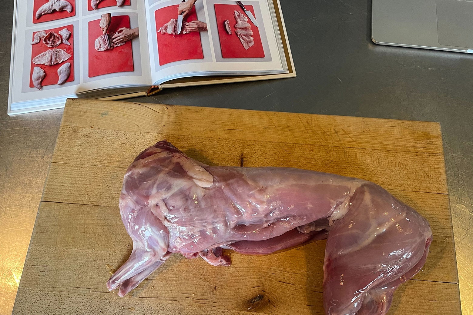 A prepared rabbit on a cutting board.