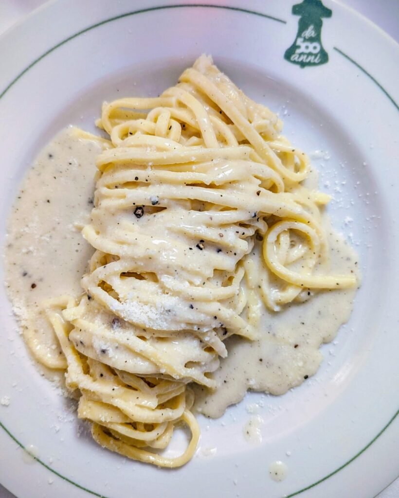 Cacio e pepe, fiori di zucca (fried courgette flowers), and olive ascolane (fried olives stuffed with meat) in Rome