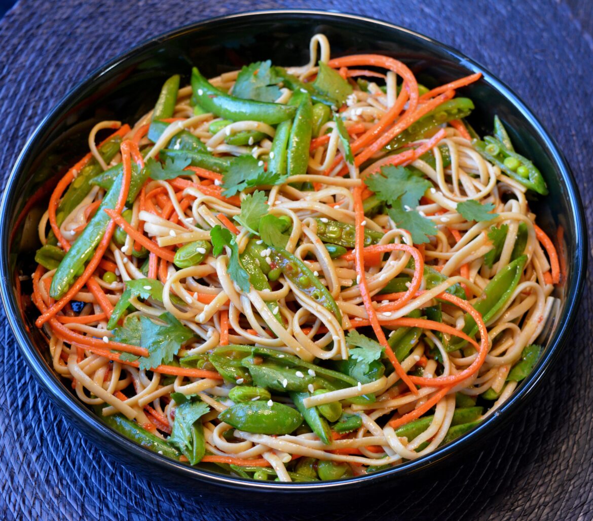(310 cal, 29 g protein) Stir fry with low cal, high protein noodles, edamame, snap peas, carrots with ginger garlic sesame sauce