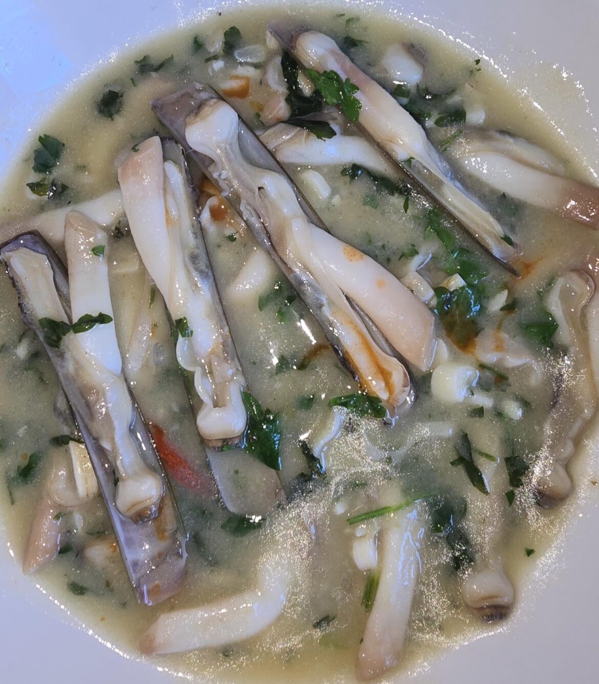 American razor clams (Ensis leei) in green sauce