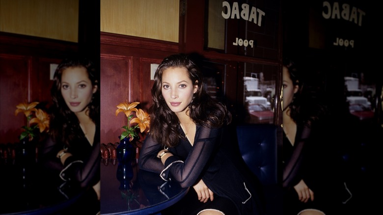 Christy Turlington posing for a photo at Cafe Tabac