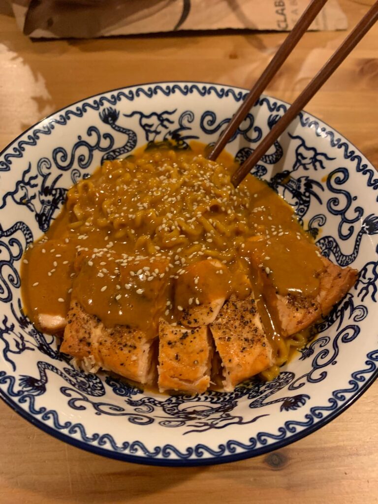 Ramped up volcano chicken noodle ramen with reaper sauce and crispy salmon