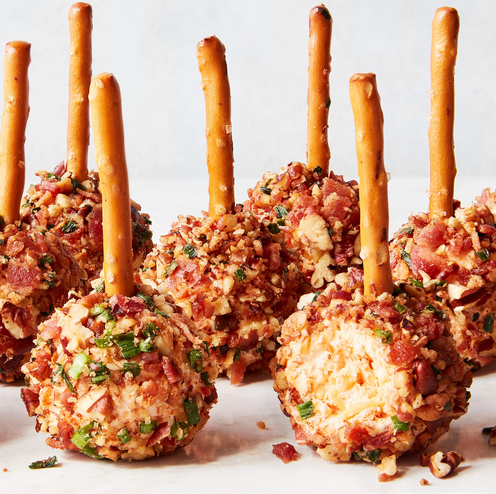 cheese ball bites with pretzel sticks