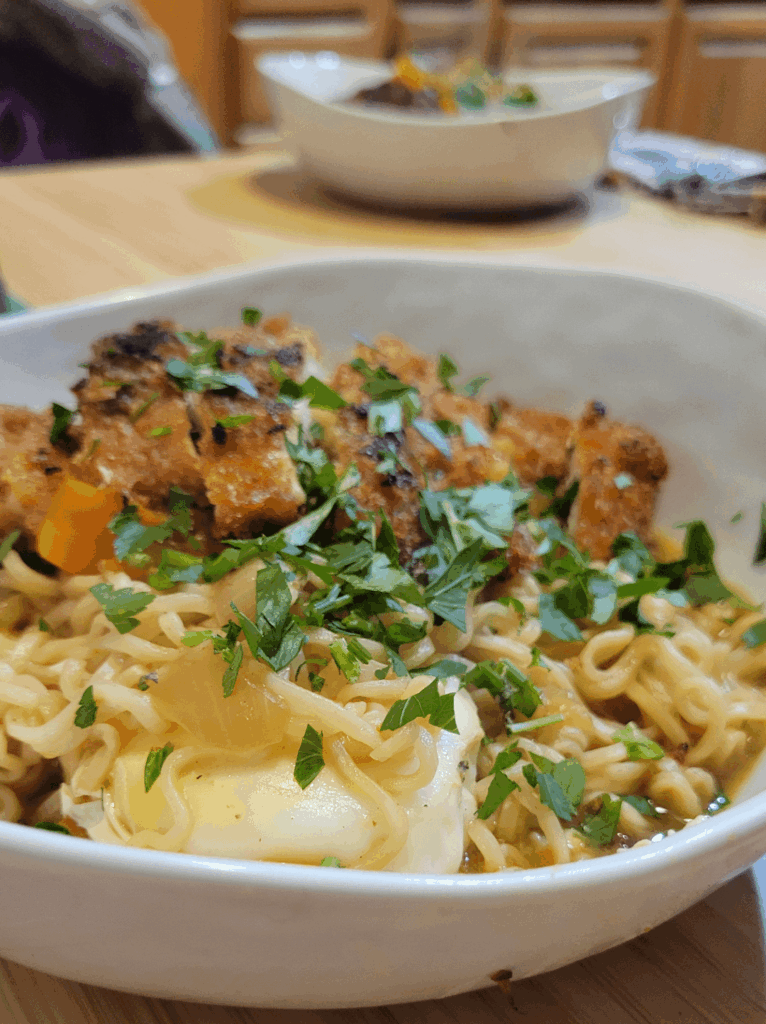 Instant Ramen with fried chicken and a poached duck egg